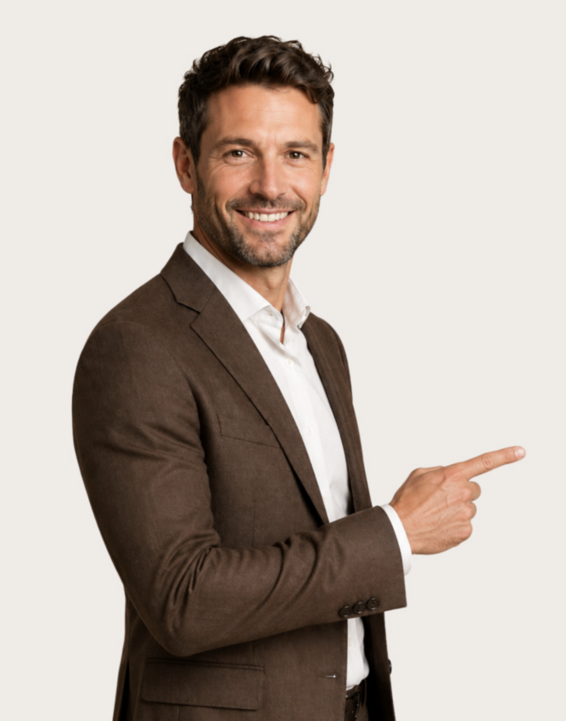 Smiling professional man in a brown suit pointing to the right
